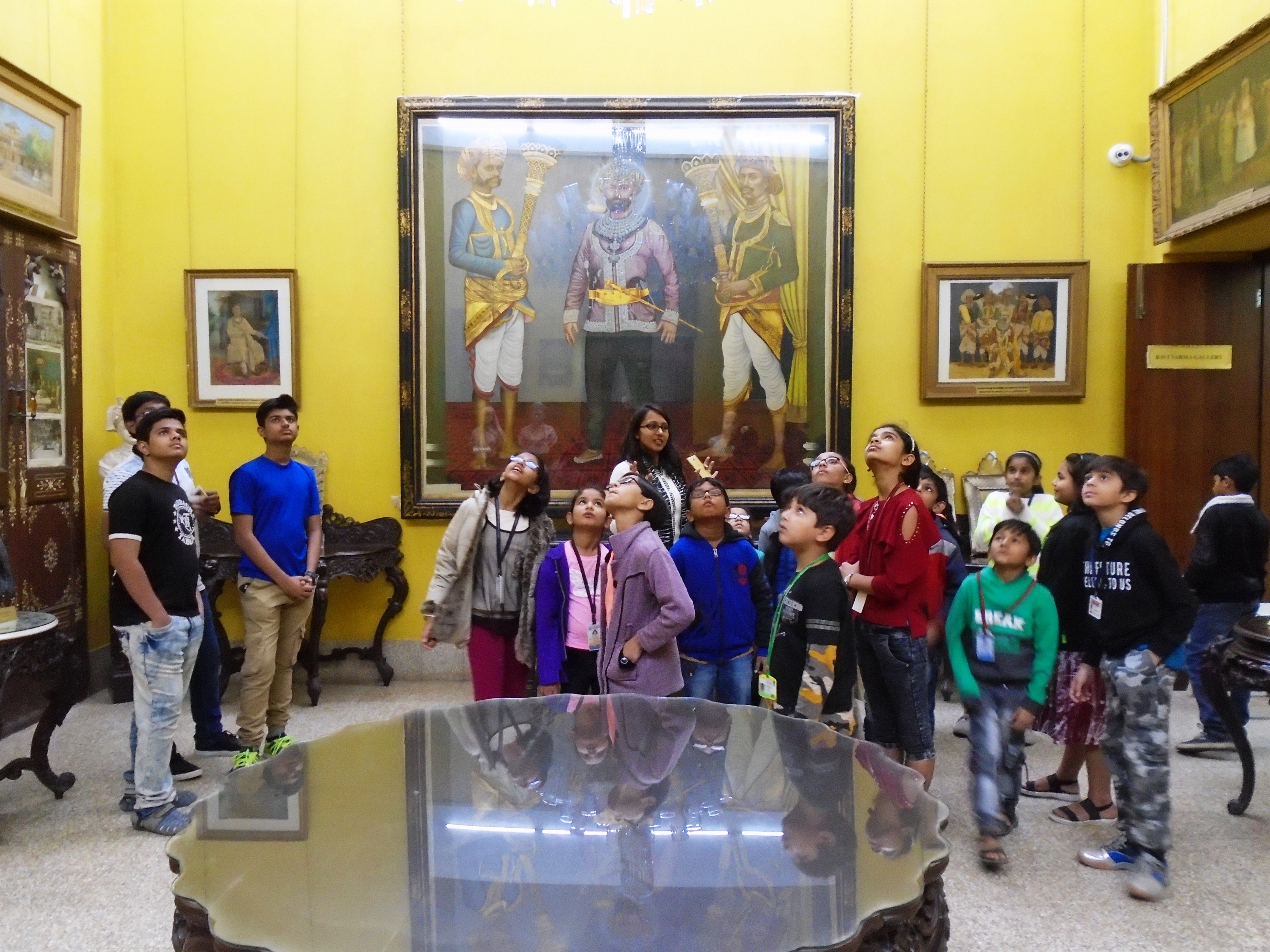 Children enjoying the Gaekwad’s collection in the ‘Old Baroda Room’ of the Maharaja Fatesingh Museum during a storytelling session.